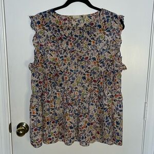 Cute sleeveless ruffled flower print blush blouse